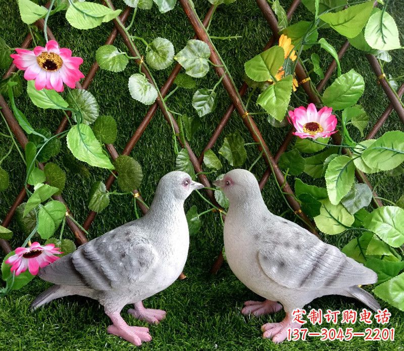 湖北雕塑小女孩一只手拿书一手和平鸽
