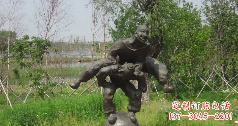 湖北园林站在球上面跳山羊的人物景观铜雕
